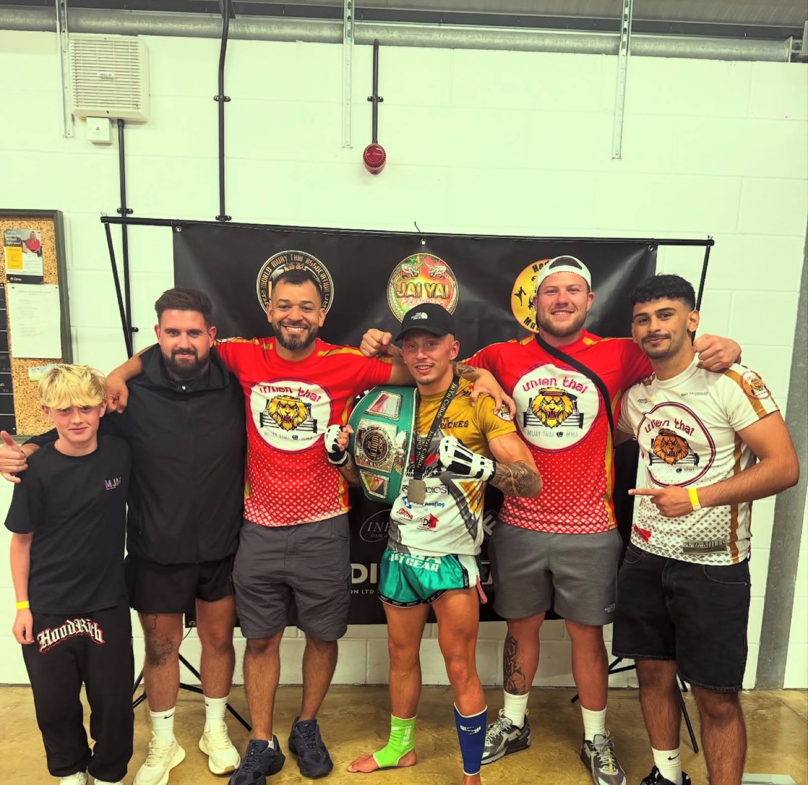 Union Thai team with a championship belt